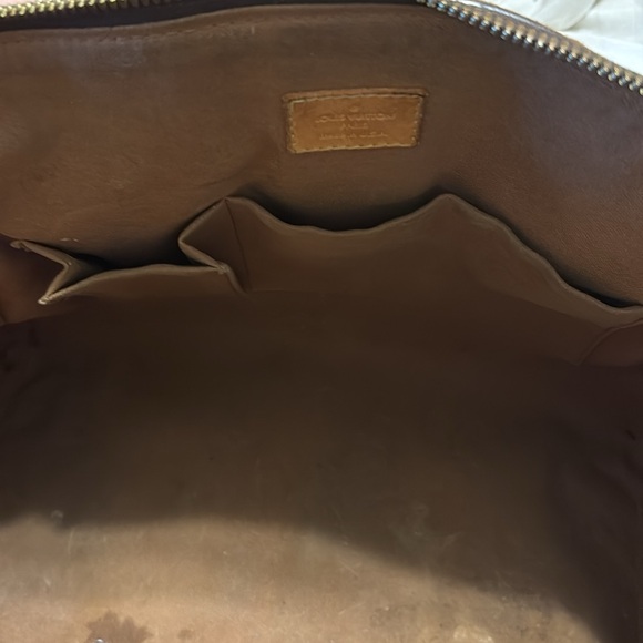 Pampered pre-owned Louis Vuitton Satchel.  Original lining can & a nicked strap.